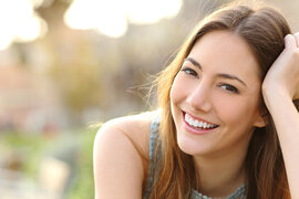 girl smiling outdoors nice teeth, Kent, WA Invisalign clear aligners treatment